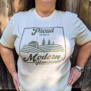 Woman in cotton t-shirt that says Proud to Be a Modern Homesteader