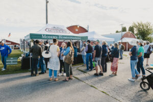 Line of people outside the Modern Homesteading Conference booth at the fairgrounds